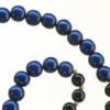 Boho Deluxe Kette mit Perlen aus vergoldetem 925 Sterlingsilber, Onyx und Holz (schwarz + dunkelblau). Mithilfe des integrierten Schiebeknotens kann die Kettenlänge nach Belieben reguliert werden.
